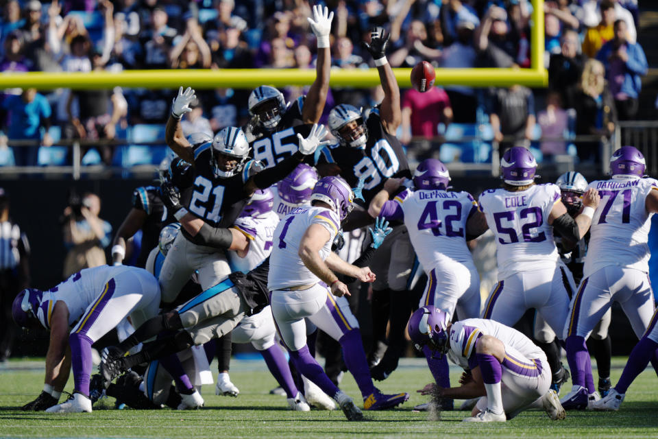 Minnesota Vikings kicker Greg Joseph (1) attempts a field goal in the last seconds of the second half of an NFL football game against the Carolina Panthers, Sunday, Oct. 17, 2021, in Charlotte, N.C. Joseph missed and the game goes into overtime. (AP Photo/Jacob Kupferman)