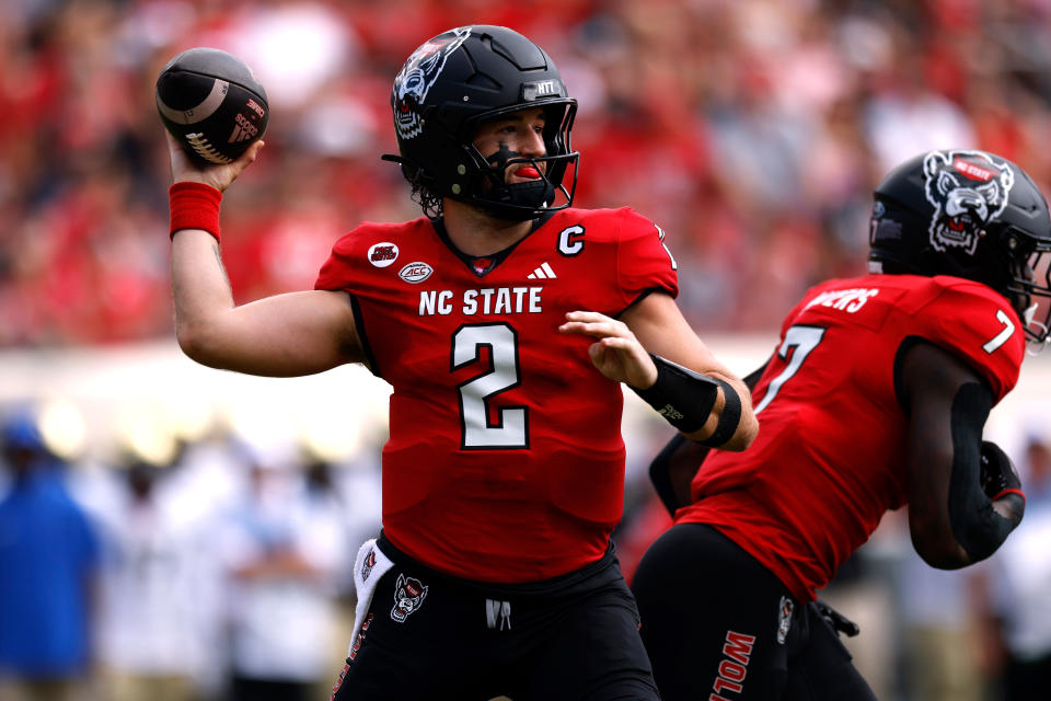 RALEIGH, NORTH CAROLINA – OCTOBER 5: Grayson McCall #2 of the NC State Wolfpack drops back to face the Wake Forest Demon Deacons during the first half of the game at Carter-Finley Stadium on October 5, 2024 in Raleigh, North Carolina. (Photo by Lance King/Getty Images)