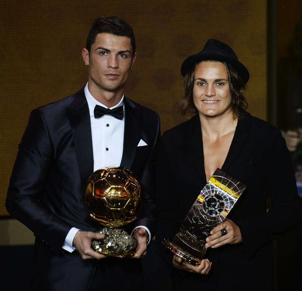 Cristiano Ronaldo of Portugal, left, and Nadine Angerer of Germany pose with their trophies after being elected FIFA Men's and Women's soccer player of the year 2013 at the FIFA Ballon d'Or 2013 gala at the Kongresshaus in Zurich, Switzerland, Monday, Jan. 13, 2014. (AP Photo/Keystone, Steffen Schmidt)