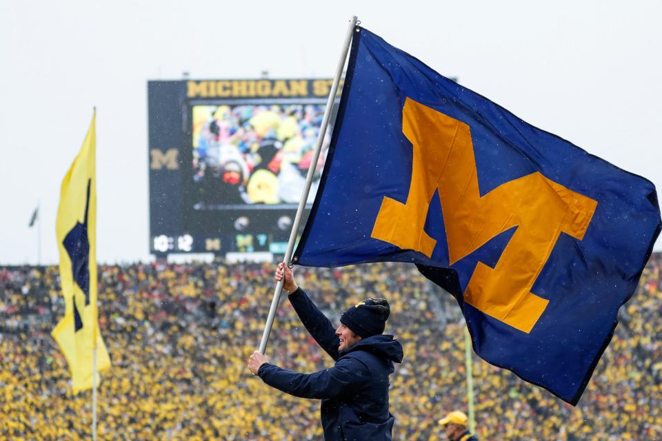 Michigan spirit squad celebrates a touchdown against Ohio State during the first half at Michigan Stadium in Ann Arbor on Saturday, Nov. 27, 2021.