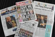 Picture taken in London on May 29, 2015 shows front pages of British national newspapers featuring images of Sepp Blatter and the story of the arrest of FIFA officals in Zurich on May 27