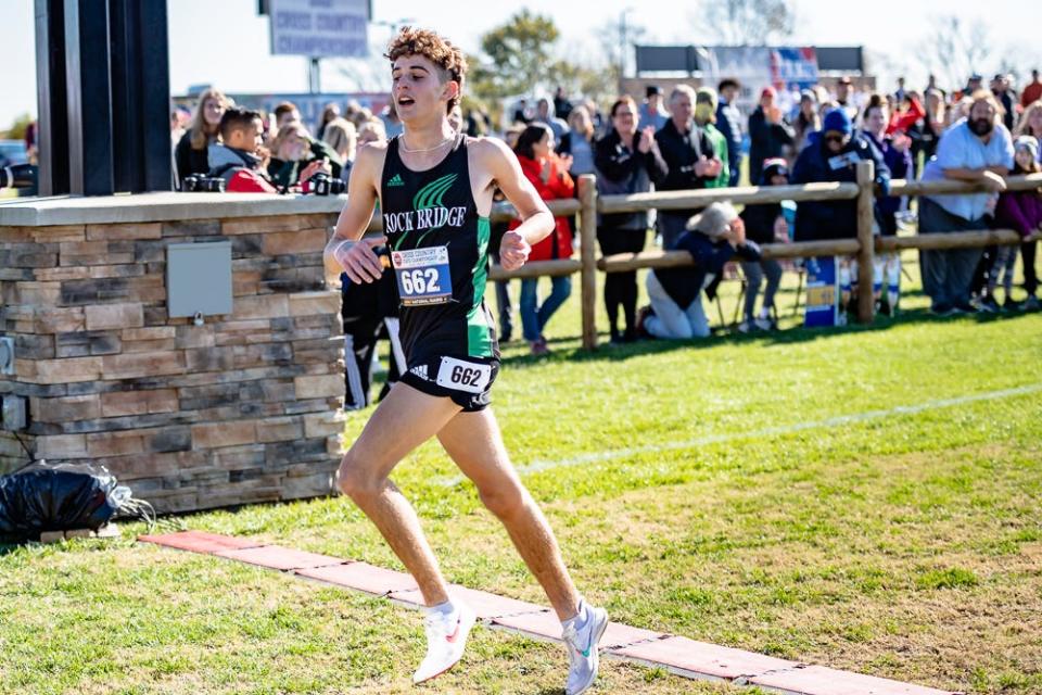 Rock Bridge's Andrew Hauser crosses the finish line as the individual champion at the MSHSAA Class 5 boys cross country state championship meet.