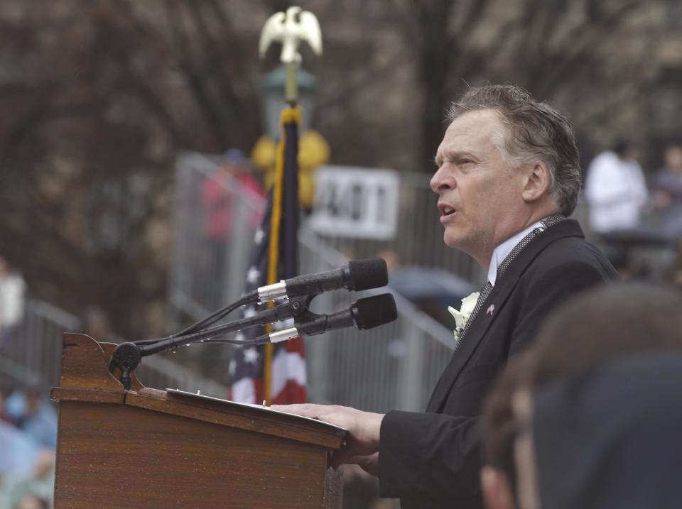 Virginia Governor Terry McAuliffe delivers his inaugural address on the steps of the South Portico of the Capitol in Richmond, Va., Saturday, Jan. 11, 2014. McAuliffe was sworn in Saturday as the 72nd Governor of Virginia. (AP Photo/Steve Helber)