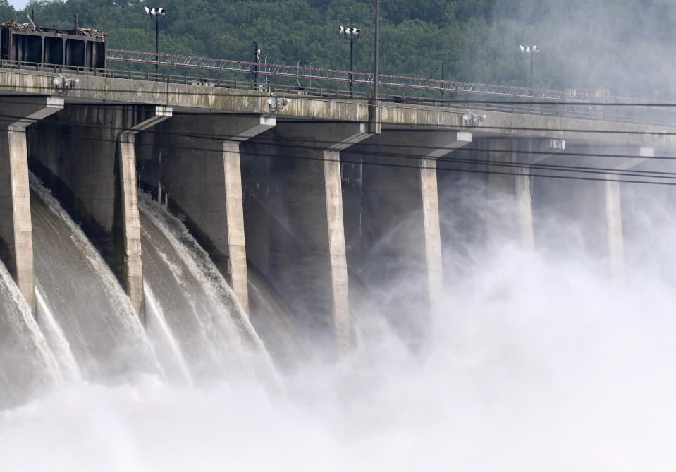 Water flows through Conowingo Dam, a hydroelectric dam spanning the lower Susquehanna River near Conowingo, Md., on Thursday, May 16, 2019. Officials once counted on the dam to block large amounts of sediment in the Susquehanna from reaching Chesapeake Bay, the nation's largest estuary, but the reservoir behind the dam has filled with sediment far sooner than expected. (AP Photo/Steve Ruark)