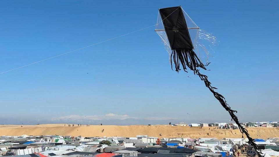 PHOTO: Children in Gaza fly kites on Friday, Feb. 9 as military escalation looms. For these children, they said flying kites is a welcome distraction from the grim reality of life in Rafah's tent city. (ABC News)