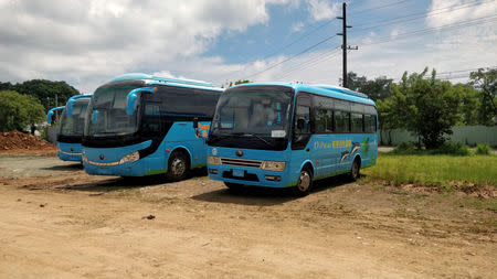 Idle Chinese tour buses park in Koror, Palau August 8, 2018. REUTERS/Farah Master