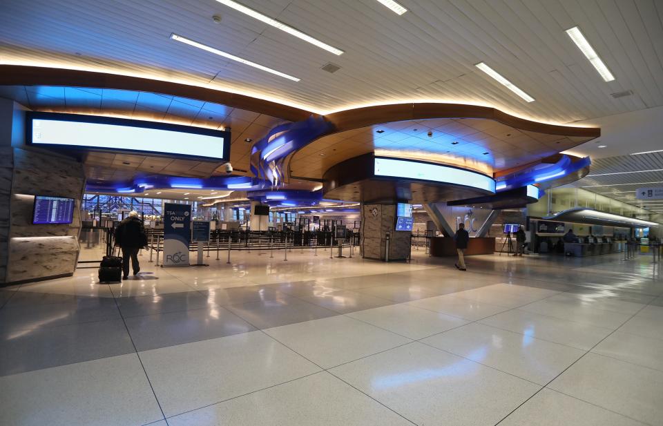 Flights were delayed across the United States due to a FAA computer glitch.  A few travelers checked in at the Frederick Douglass Greater Rochester International Airport in Rochester on Jan. 11.  Passengers head towards security check in before going to their gate.