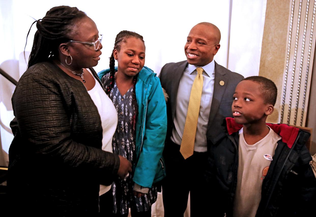 Newly-elected Milwaukee Mayor Cavalier Johnson, center, poses with Teresa Howell-Smith, left, and her children, Mackenzie, 11, and Michaeldavid, 8, right, at his election party at the Hilton Milwaukee City Center Hotel on Tuesday, April 5, 2022.