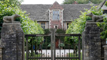 A gate protects the entrance of the Rooksnest estate near Lambourn, England, Tuesday, Aug. 6, 2019. The manor is the domain of Theresa Sackler, widow of one of Purdue Pharma’s founders and, until 2018, a member of the company’s board of directors. A complex web of companies and trusts are controlled by the family, and an examination reveals links between far-flung holdings, far removed from the opioid manufacturer’s headquarters in Stamford, Conn. (AP Photo/Frank Augstein)