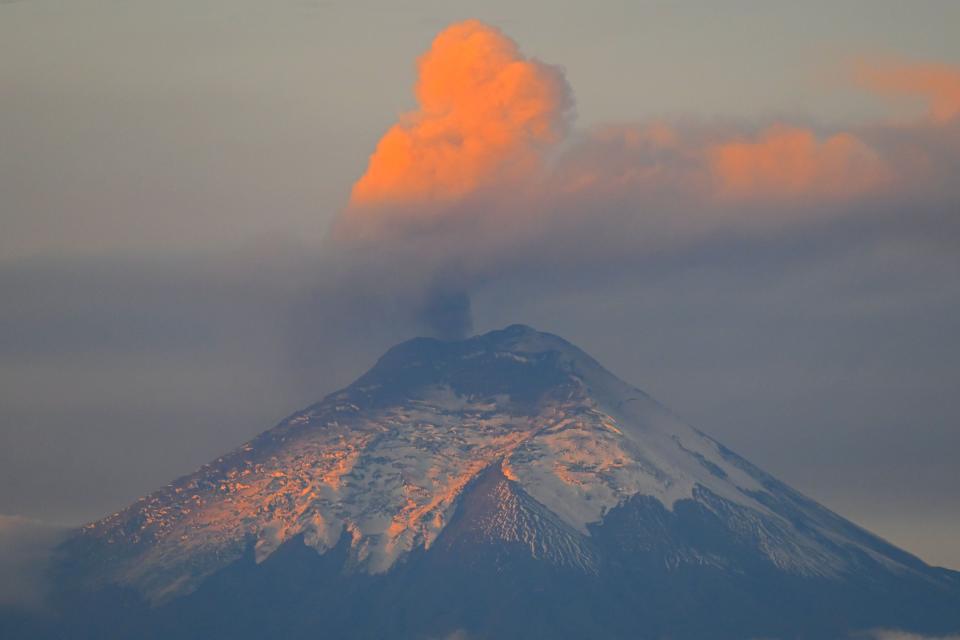 April 10, 2023:  A plume of steam and gas billows from the Cotopaxi volcano as seen from Quito, Ecuador.