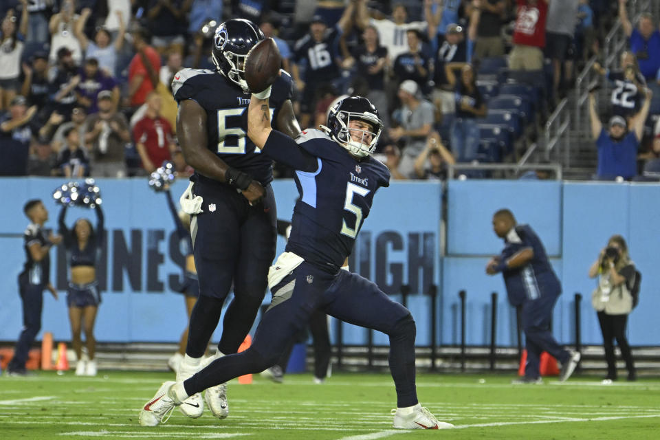 Tennessee Titans quarterback Logan Woodside (5) spikes the ball after scoring a touchdown on a 9-yard run against the Arizona Cardinals in the second half of a preseason NFL football game Saturday, Aug. 27, 2022, in Nashville, Tenn. (AP Photo/John Amis)