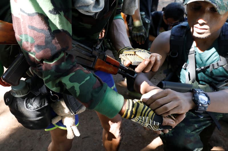 The Wider Image: In Myanmar jungle, civilians prepare to battle military rulers