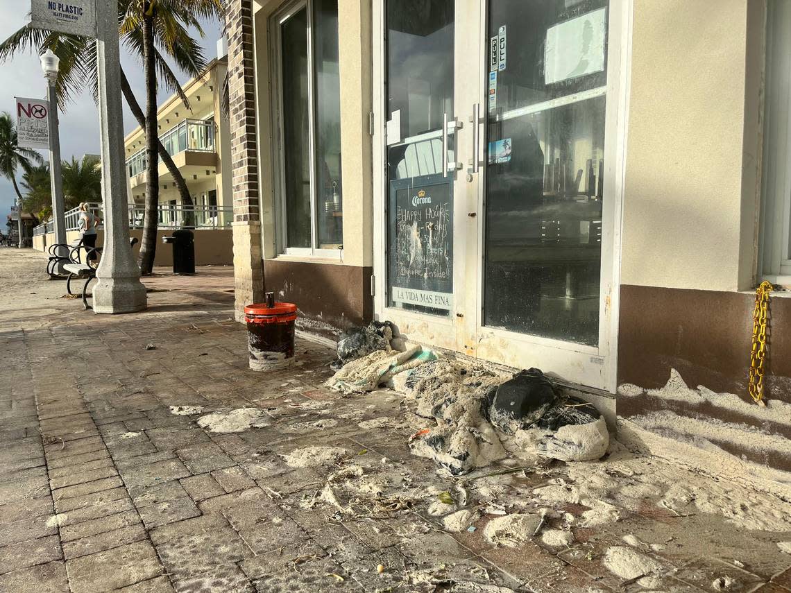 Waves from Hurricane Nicole pushed sand up onto the Hollywood Broadwalk on Thursday, Nov. 10, 2022.