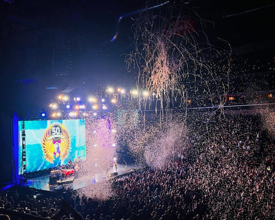 Confetti rains down above Wells Fargo Arena crowd during Journey's 50th Anniversary Tour.