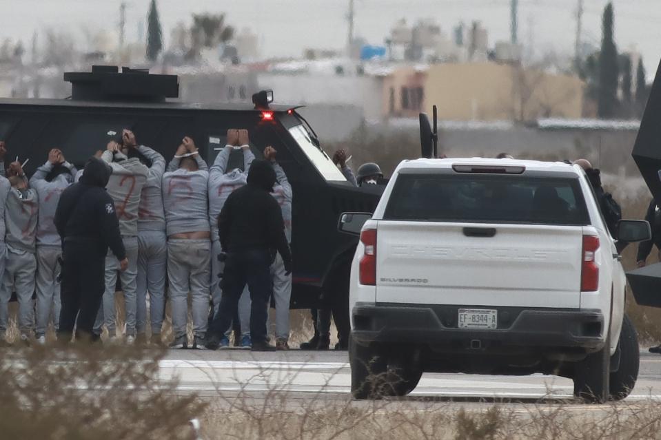 Inmates from the CERESO #3 Ciudad Juarez prison are transported to other prisons in Mexico after dozens had escaped on New Year’s Day and a day after armed commandos attacked Chihuahua State Police, killing two officers on Monday. 