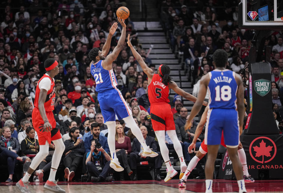 TORONTO, ON - APRIL 7: Joel Embiid #21 of the Philadelphia 76ers puts up a shot against Precious Achiuwa #5 of the Toronto Raptors during the second half of their basketball game at the Scotiabank Arena on April 7, 2022 in Toronto, Ontario, Canada. NOTE TO USER: User expressly acknowledges and agrees that, by downloading and/or using this Photograph, user is consenting to the terms and conditions of the Getty Images License Agreement. (Photo by Mark Blinch/Getty Images)