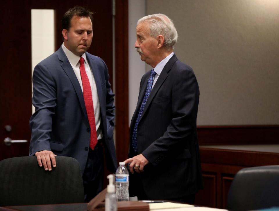 (L to R) Former assistant prosecutor Derek Miller talks with his attorney Steve Fishman before the preliminary exam of former Macomb County Prosecutor Eric Smith and himself in front of visiting Judge Cynthia Arvant inside 41B District Court in Clinton Township on July 9, 2021.