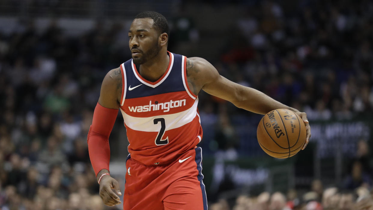 Wizards star John Wall played 41 minutes against the Hornets on his ailing left knee. (AP)