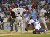 CHICAGO, IL - JUNE 16: Mike Aviles #3 of the Boston Red Sox scores as Welington Castillo #53 of the Chicago Cubs takes the throw in the seventh inning on June 16, 2012 at Wrigley Field in Chicago, Illinois. (Photo by David Banks/Getty Images)