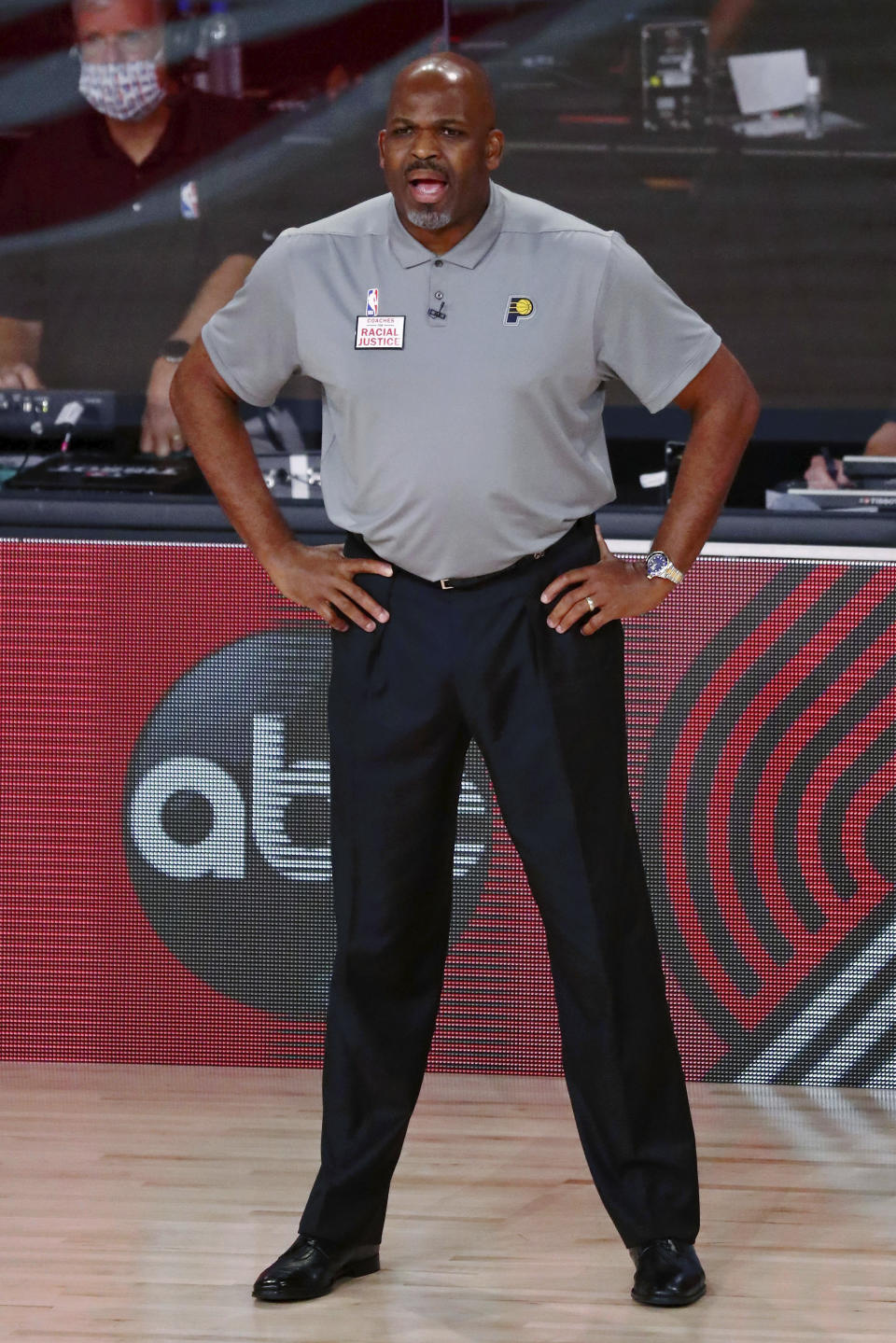 Indiana Pacers head coach Nate McMillan watches the first half of Game 3 of an NBA basketball first-round playoff series against the Miami Heat, Saturday, Aug. 22, 2020, in Lake Buena Vista, Fla. (Kim Klement/Pool Photo via AP)