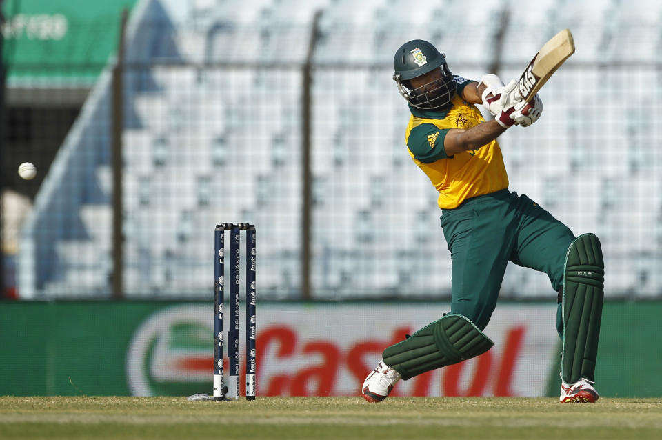 South Africa's Hashim Amla plays a shot during their ICC Twenty20 Cricket World Cup match against New Zealand in Chittagong, Bangladesh, Monday, March 24, 2014. (AP Photo/A.M. Ahad)