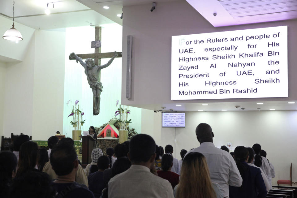 In this Sunday, Jan. 20, 2019 photo, parishioners attending Mass at St. Mary's Catholic Church pray for rulers of the United Arab Emirates, in Dubai, United Arab Emirates. Pope Francis’ visit to the United Arab Emirates from Feb. 3 through Feb. 5, marks the first ever papal visit to the Arabian Peninsula, the birthplace of Islam. The Catholic Church believes there are some 1 million Catholics in the UAE today. (AP Photo/Jon Gambrell)