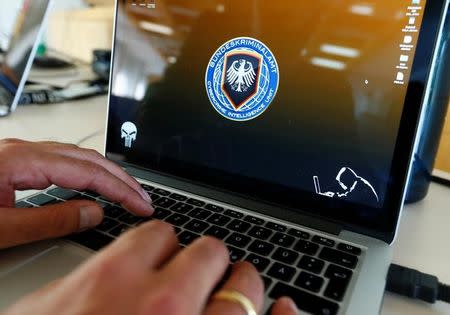 An investigator of the Cybercrime Intelligence Unit of Germany's Bundeskriminalamt (BKA) Federal Crime Office is pictured during a media day in Wiesbaden, Germany, July 27, 2016. REUTERS/Ralph Orlowski