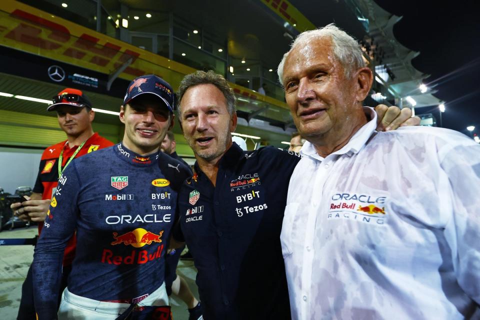 Horner with Verstappen (left) and Helmut Marko (right) (Getty)