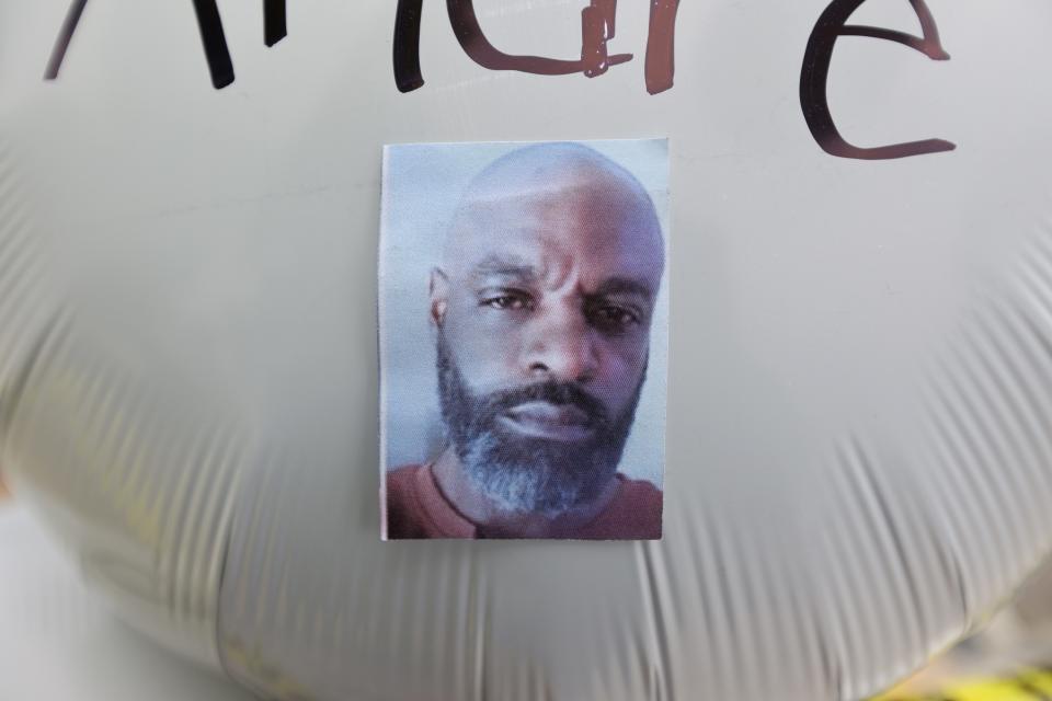 A photograph of Andre Mackniel is shown on a balloon attached outside the Tops Family Markets store in Buffalo where 10 people were killed.