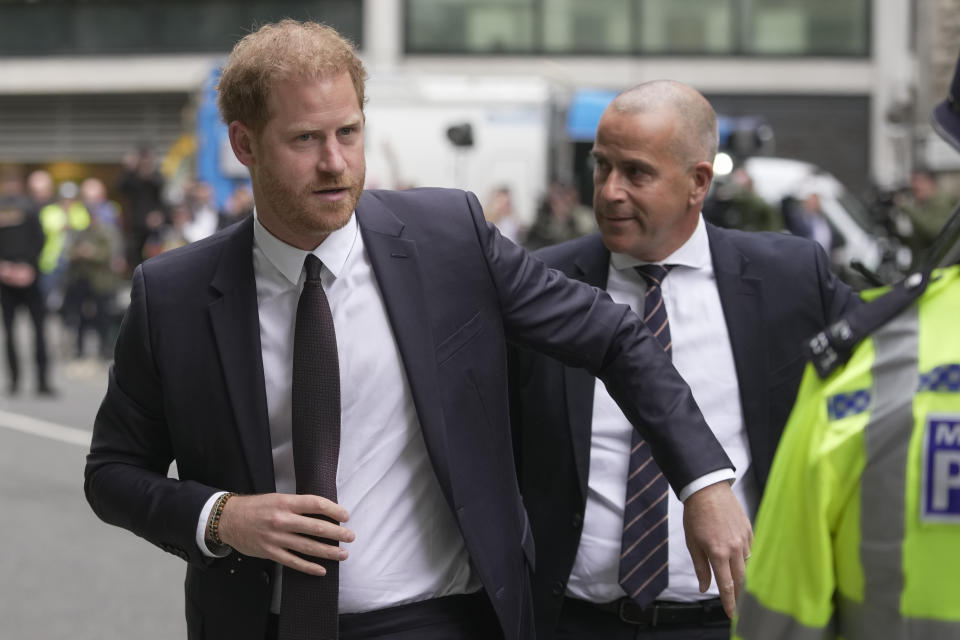 Prince Harry arrives at the High Court in London, Tuesday, June 6, 2023. Prince Harry is due at a London court to testify against a tabloid publisher he accuses of phone hacking and other unlawful snooping. Harry alleges that journalists at the Daily Mirror and its sister papers used unlawful techniques on an "industrial scale" to get scoops. Publisher Mirror Group Newspapers is contesting the claims. (AP Photo/Kin Cheung)