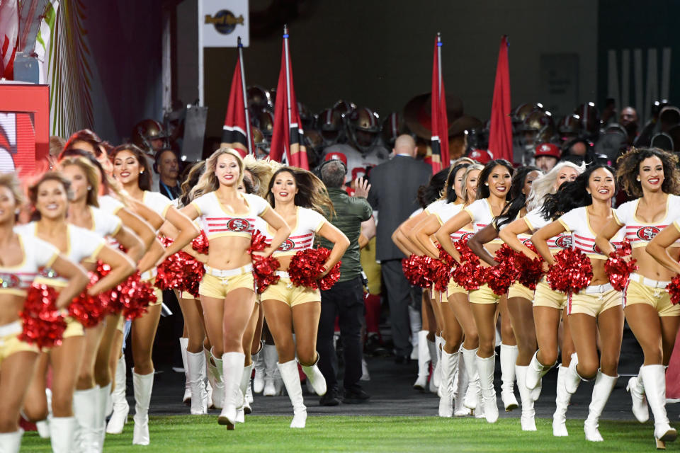 MIAMI GARDENS, FLORIDA - FEBRUARY 02: 49ers cheerleaders run onto the field during the Super Bowl LIV Pregame at Hard Rock Stadium on February 02, 2020 in Miami Gardens, Florida. (Photo by Kevin Mazur/WireImage)