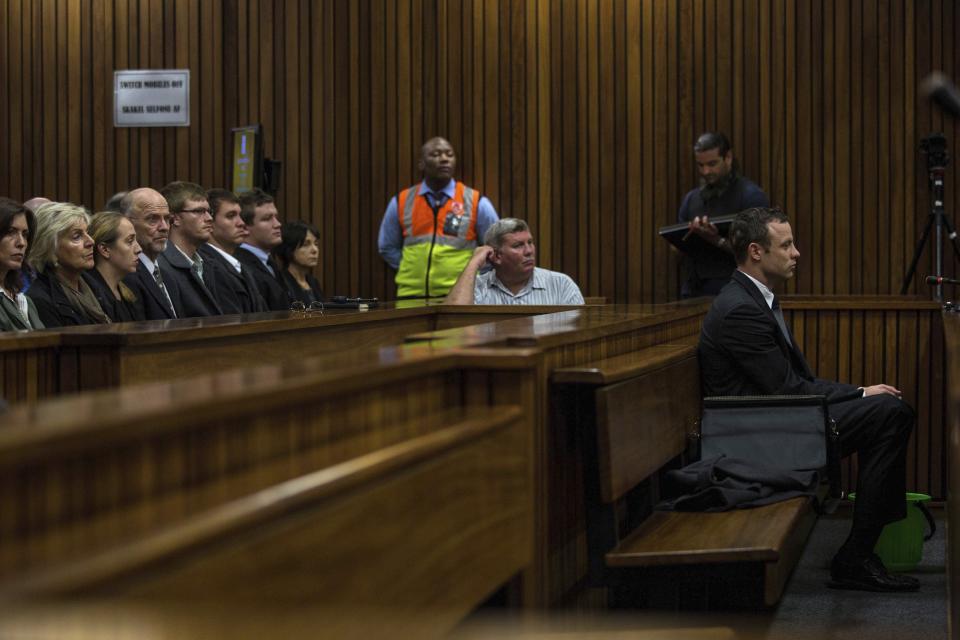 Olympic and Paralympic track star Oscar Pistorius sits in the dock at the North Gauteng High Court in Pretoria March 11, 2014. Pistorius is on trial for the murder of his girlfriend Reeva Steenkamp at his suburban Pretoria home on Valentine's Day last year. REUTERS/Kevin Sutherland/Pool (SOUTH AFRICA - Tags: SPORT CRIME LAW)