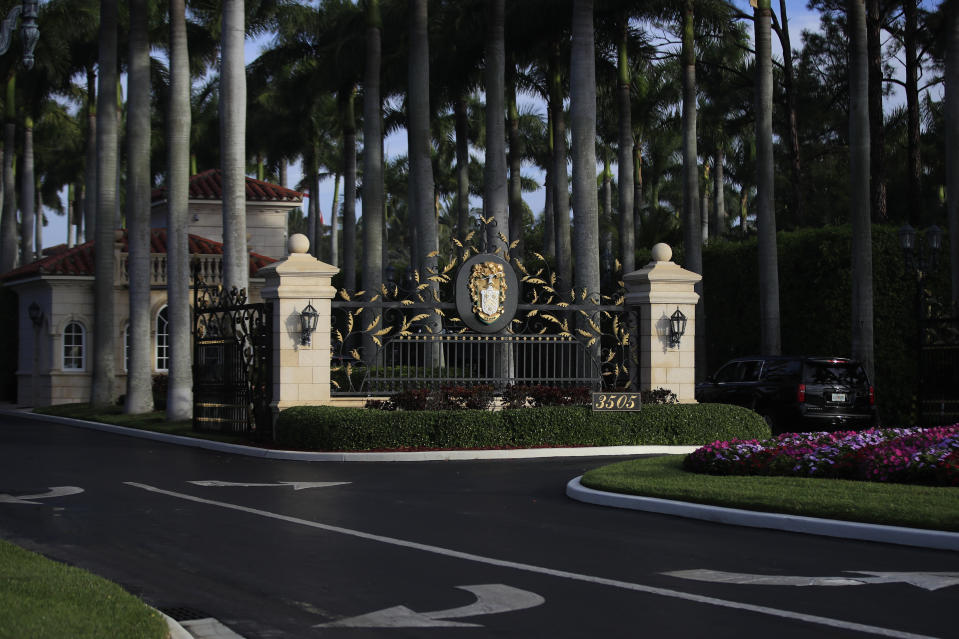 The entrance to Trump International Golf Club in West Palm Beach, Fla., is shown, Sunday, Feb. 3, 2019, as President Donald Trump's motorcade arrives. (AP Photo/Manuel Balce Ceneta)