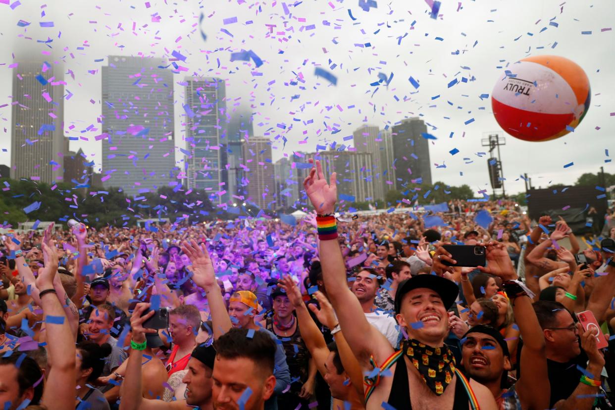 Confetti flies as people gather at Chicago's Grant Park during the Pride in the Park festival, Saturday, June 26, 2021.