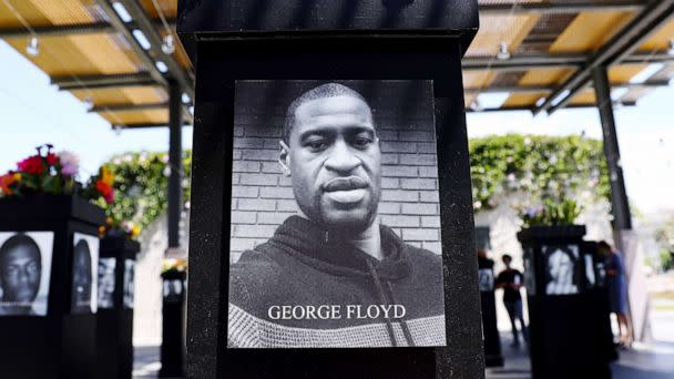 PHOTO: A photograph of George Floyd is displayed along with other photographs at the Say Their Names memorial exhibit at Martin Luther King Jr. Promenade, July 20, 2021, in San Diego, Calif. (Mario Tama/Getty Images)