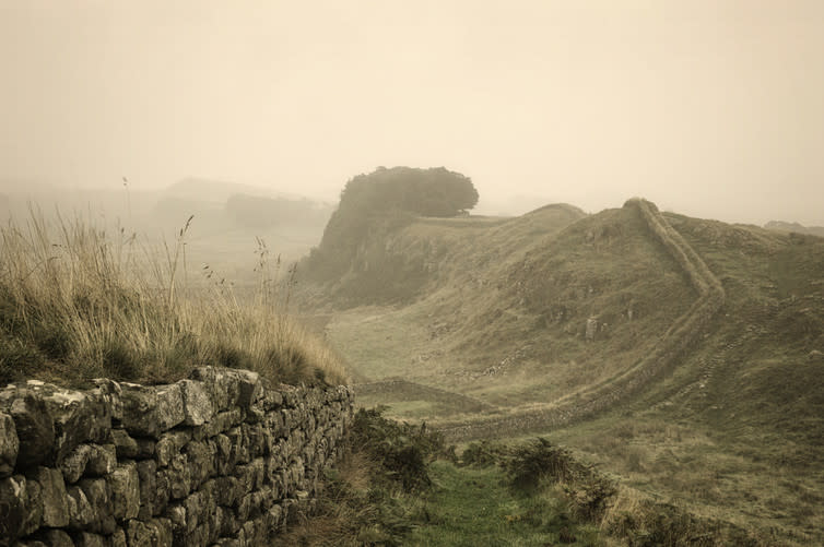 <span class="caption">Hadrian’s Wall: the edges of empire.</span> <span class="attribution"><a class="link " href="https://www.shutterstock.com/image-photo/early-morning-fog-has-descended-over-218419066?src=fCQIeno--wTFawWPTCLDMw-1-2" rel="nofollow noopener" target="_blank" data-ylk="slk:Shutterstock;elm:context_link;itc:0;sec:content-canvas">Shutterstock</a></span>