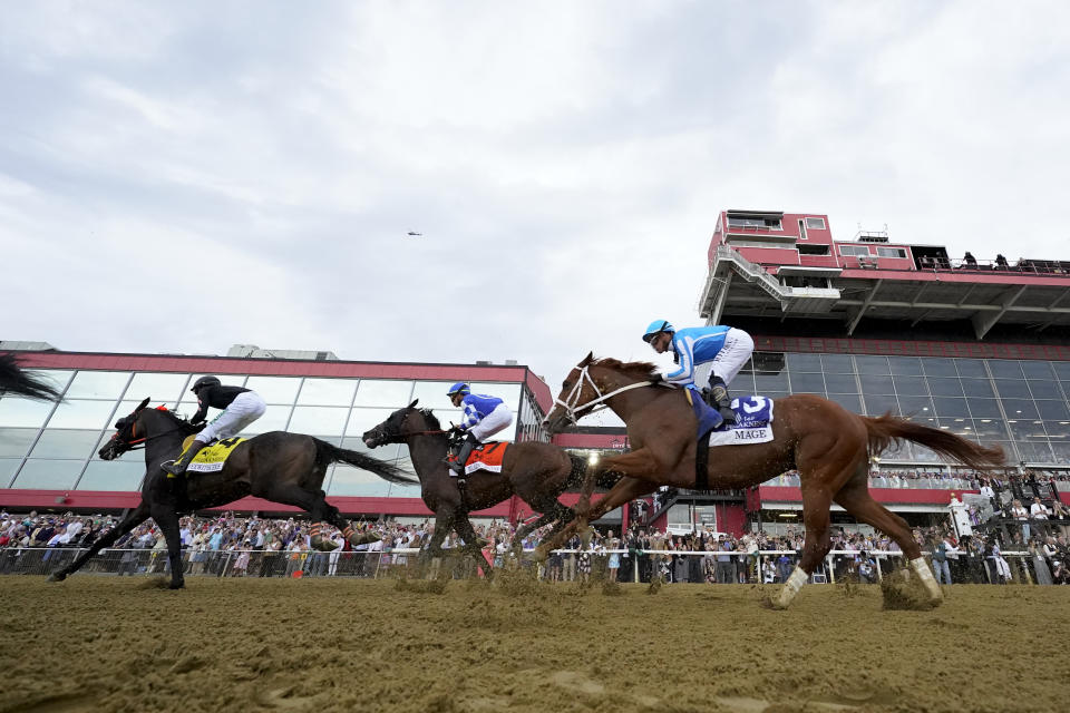 Coffeewithchris (4), with jockey Jamie Rodriguez, Blazing Sevens (7), with jockey Irad Ortiz Jr., and Mage (3), with jockey Javier Castellano, compete during the148th running of the Preakness Stakes horse race at Pimlico Race Course, Saturday, May 20, 2023, in Baltimore. (AP Photo/Julio Cortez)