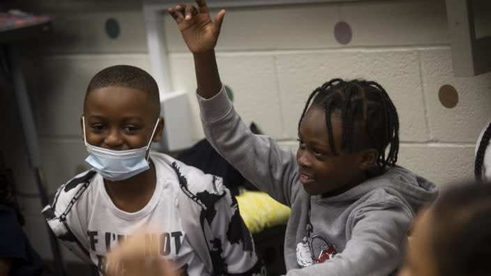A third-grade student raises his hand in class at Beecher Hills Elementary School in Atlanta. Mounting evidence shows that students who took part in remote learning during the coronavirus pandemic lost about half of an academic year of learning. (Photo: Ron Harris/AP)
