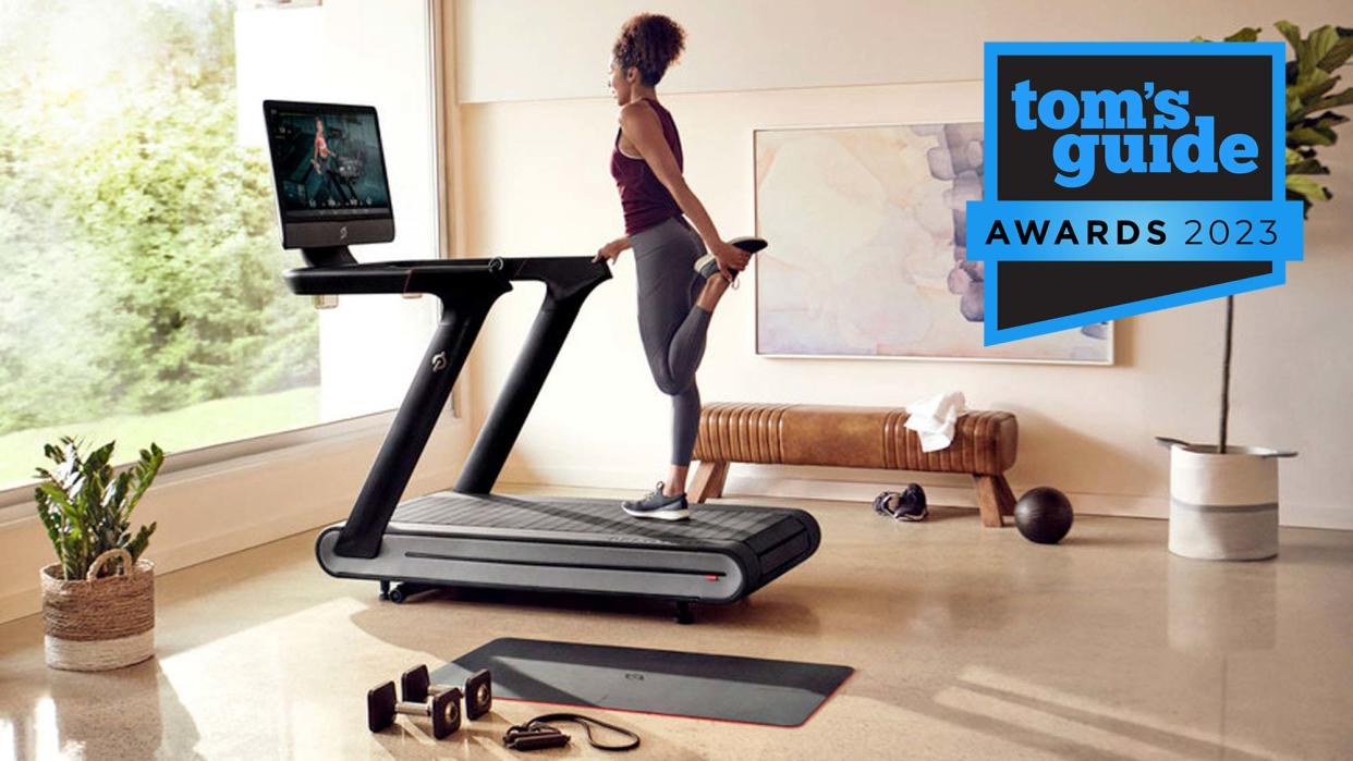  Tom's Guide Awards 2023: Woman stretching on a Peloton Tread during workout 