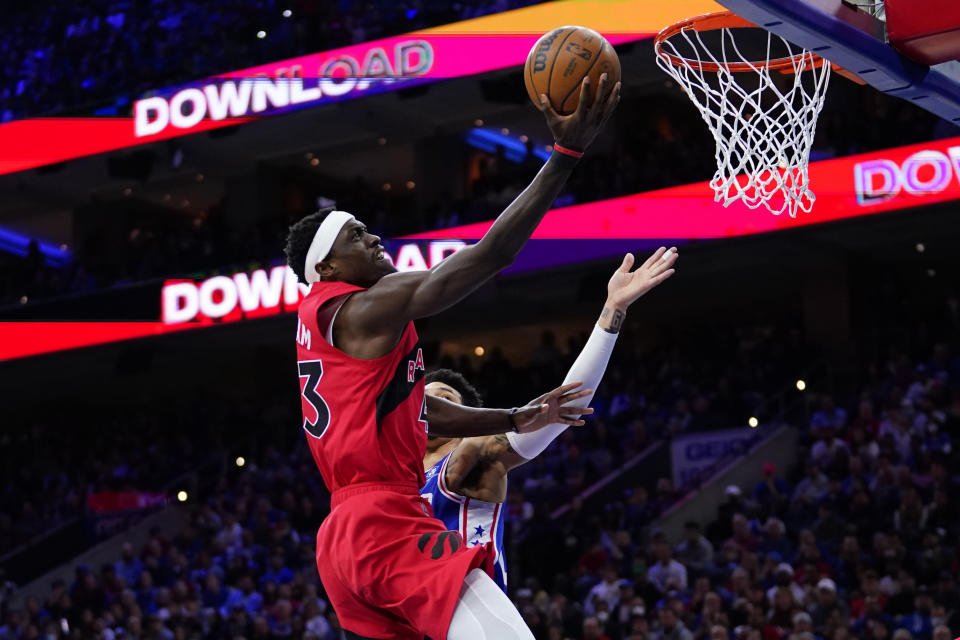 Toronto Raptors' Pascal Siakam, left, goes up for a shot past Philadelphia 76ers' Danny Green during the first half of Game 5 in an NBA basketball first-round playoff series, Monday, April 25, 2022, in Philadelphia. (AP Photo/Matt Slocum)