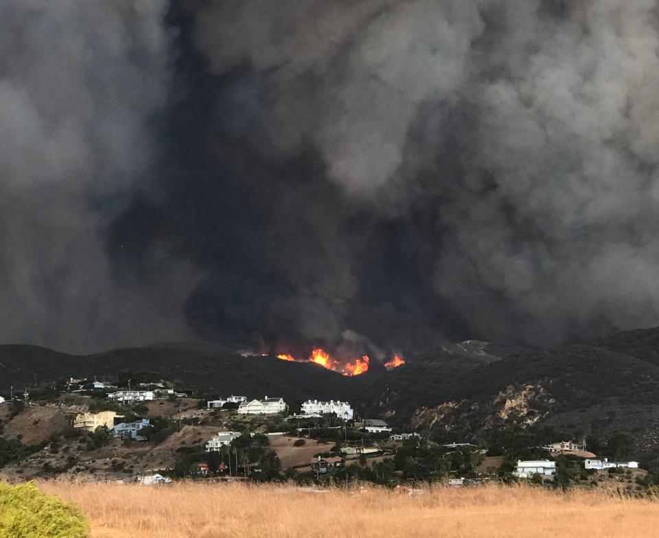 Carol De La Sotta took this image in Malibu as the Woolsey Fire burned toward the coast in November 2018. Later, her home in Ventura County would be destroyed by the fire.
