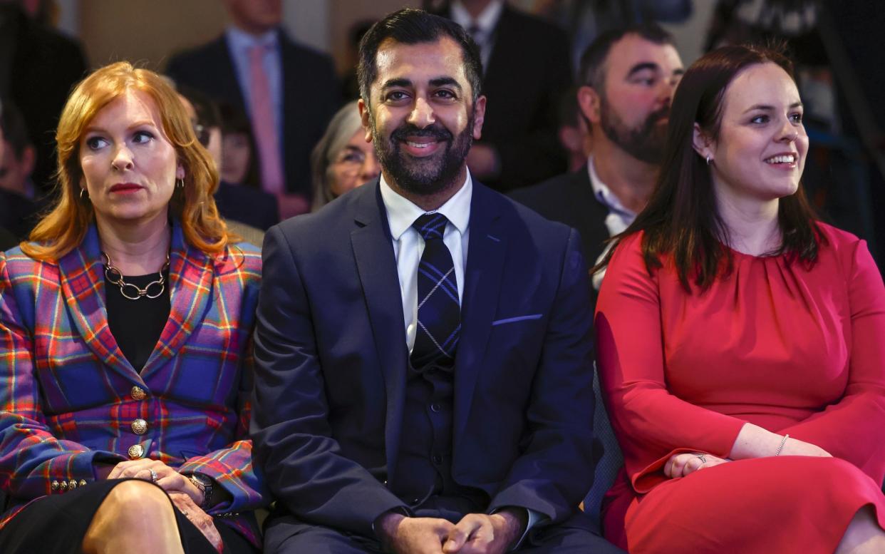 The three candidates (who know the result at this stage) practise their poker faces - with various degrees of success - Jeff J Mitchell/Getty Images Europe