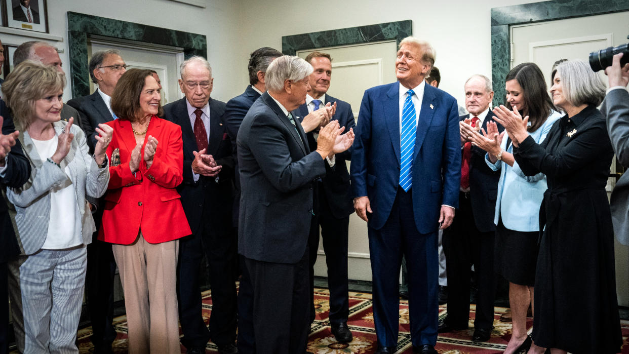  Senate Republicans clap for Donald Trump. 