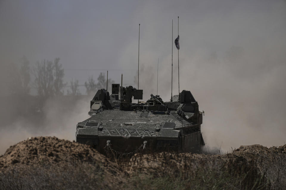 Israeli soldiers move on armored personnel carriers (APC) near the Israeli-Gaza border, in southern Israel, Wednesday, May 8, 2024. (AP Photo/Tsafrir Abayov)