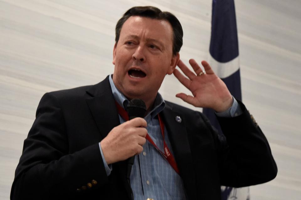 South Carolina Republican Party Chairman Drew McKissick gestures as he speaks to the Richland County GOP convention on Friday, April 30, 2021, in , S.C. (AP Photo/Meg Kinnard)