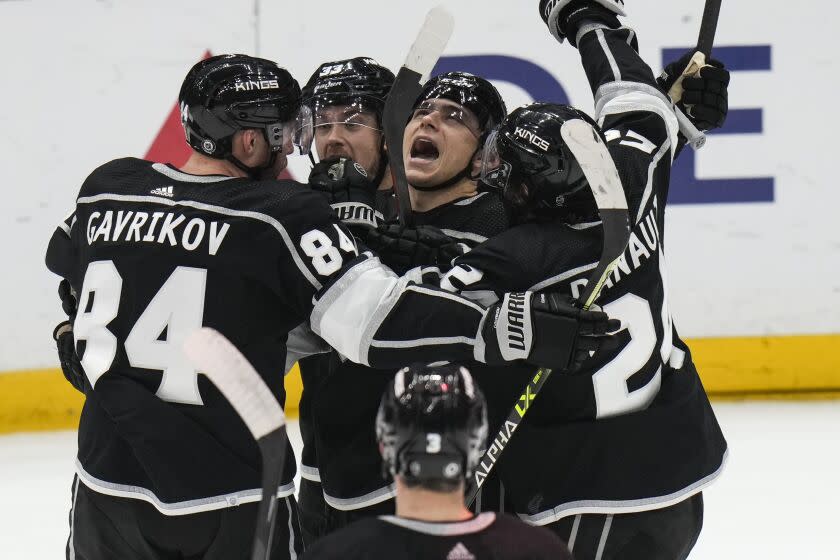 Los Angeles Kings' Trevor Moore, center right, celebrates his goal.