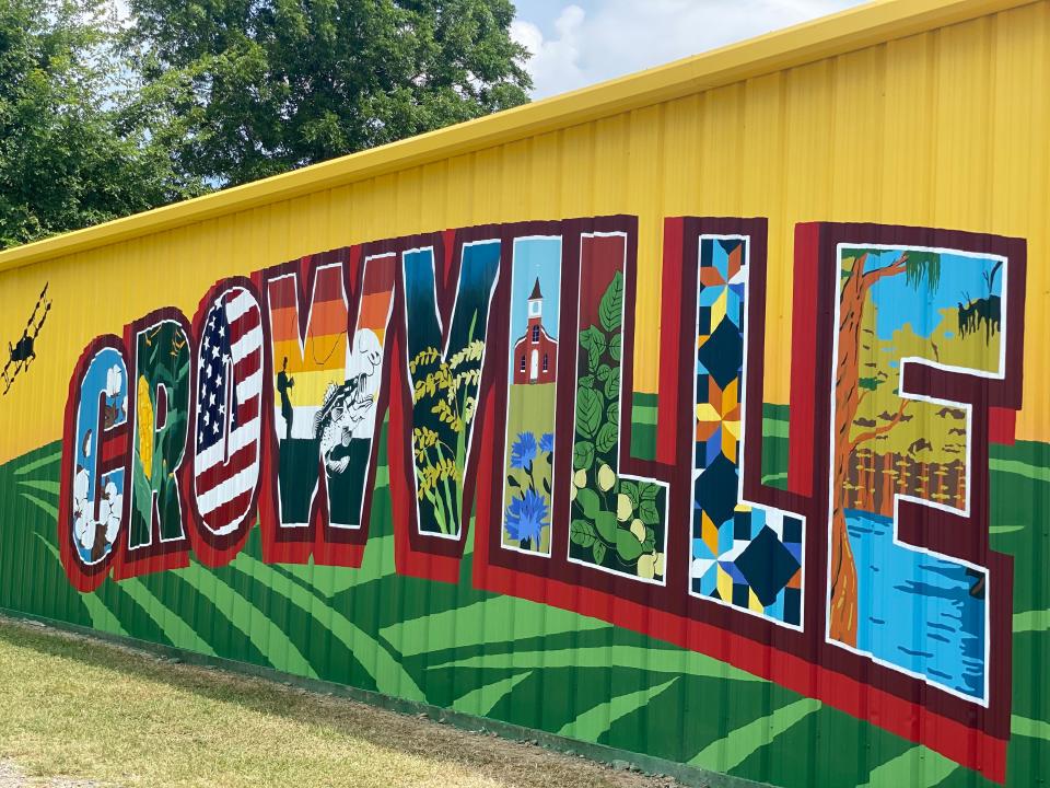 The newly painted postcard mural is on display on the side of the volunteer fire station in Crowville. There will be a dedication ceremony for the mural July 12.