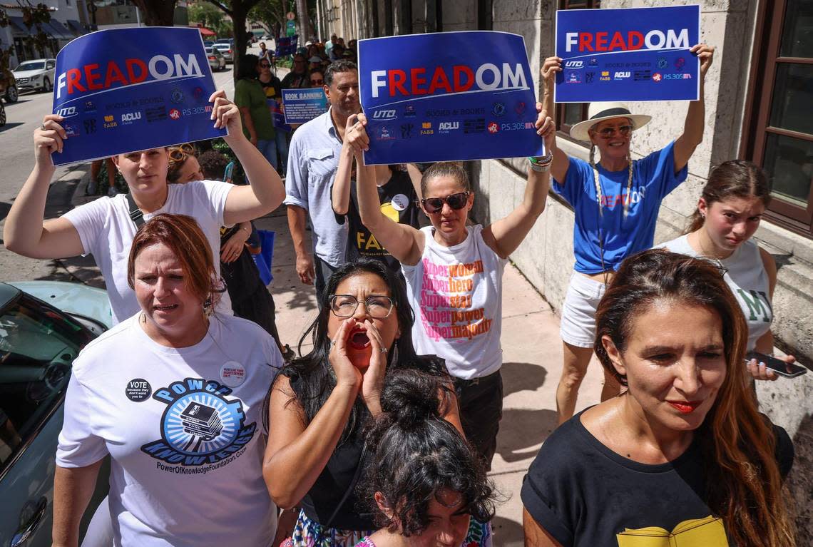 Karla Hernandez-Mats, president of United Teacher of Dade, center, leads in chanting slogans against book banning as marchers arrive at Book & Books during the “Walk for Freadom” kickoff event on Sunday, October 1, 2023 in Coral Gables, Florida. The march began at the Coral Gables Congregational United Church of Christ and ended at Books & Books.