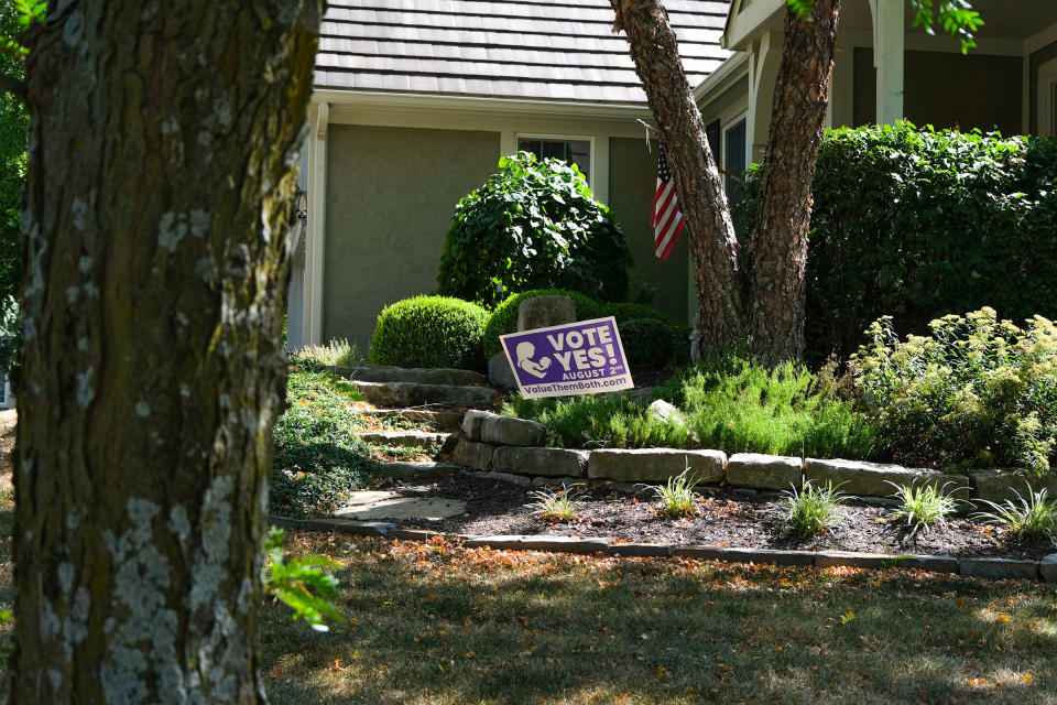 A 'Value Them Both' sign is displayed in the yard of a home in Olathe.<span class="copyright">Arin Yoon for TIME</span>