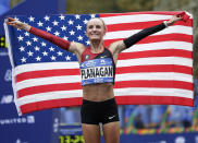 <p>Shalane Flanagan of the United States poses for pictures after crossing the finish line first in the women’s division of the New York City Marathon in New York, Nov. 5, 2017. (Photo: Seth Wenig/AP) </p>